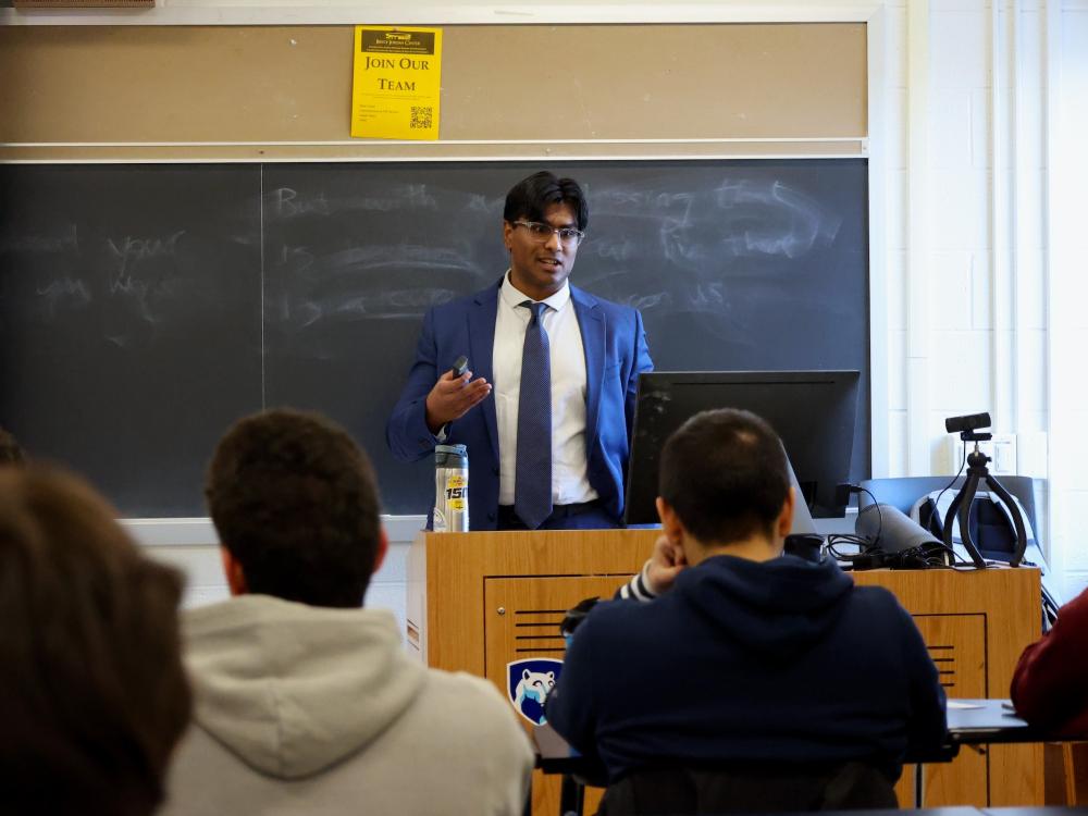 Ayaan Umar speaking in front of class