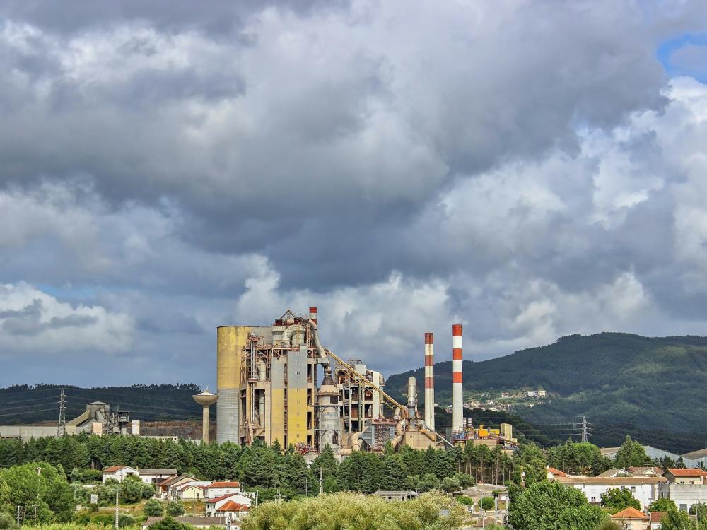 Factory situated in a rural landscape.