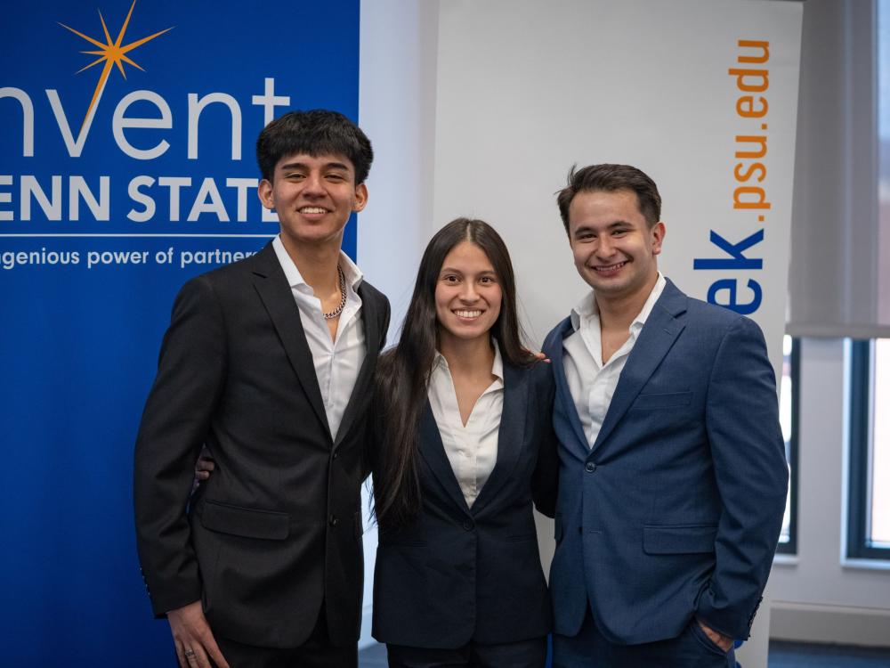 three young adults in business attired