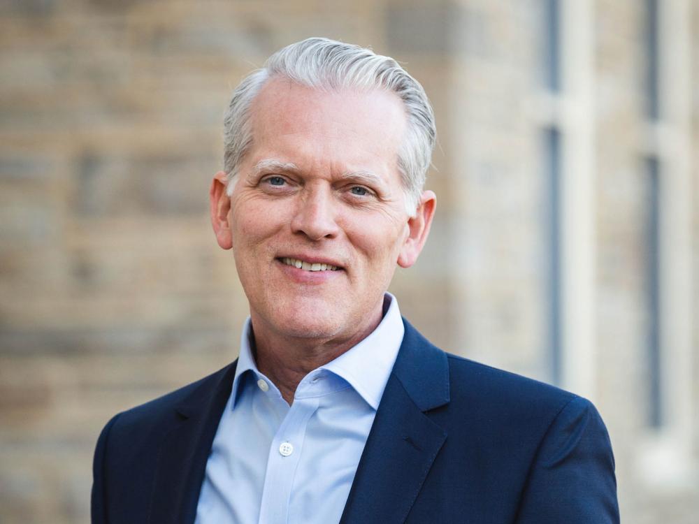David J. Lieb stands outside of Old Main on the University Park campus.