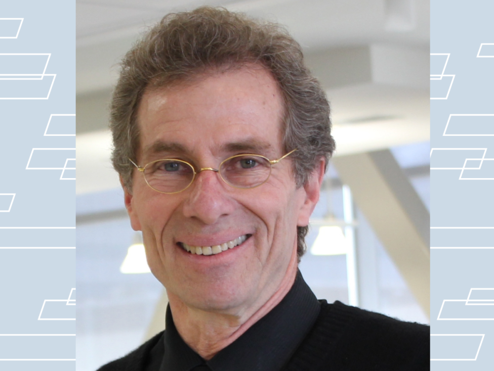 closeup portrait of smiling man with glasses
